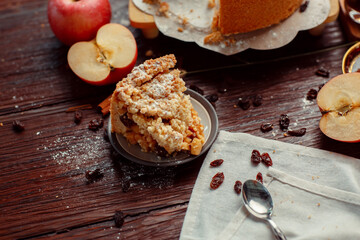 Homemade delicious apple pie with different ingredients on rustic background. Classic autumn...
