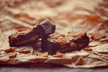 Delicious chocolate brownies with speculaas biscuits on rustic background. Chocolate dessert...
