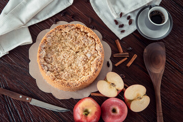 Homemade delicious apple pie with different ingredients on rustic background. Classic autumn Thanksgiving dessert - organic apple pie.
