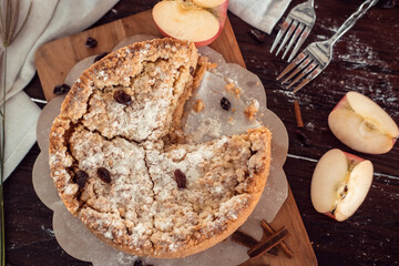 Homemade delicious apple pie with different ingredients on rustic background. Classic autumn Thanksgiving dessert - organic apple pie.