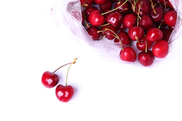 Obraz na płótnie Canvas red fresh ripe cherries on white