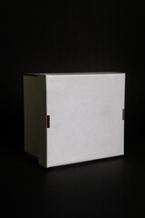 White cardboard box isolated on a black background. template for your design