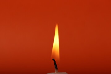 aroma vanilla candels on the orange mono color background. minimalism