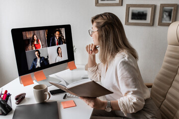 Video conference. Manager hold a business meeting on a computer from home