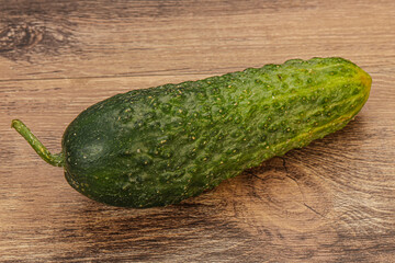 Green ripe fresh cucumber over background