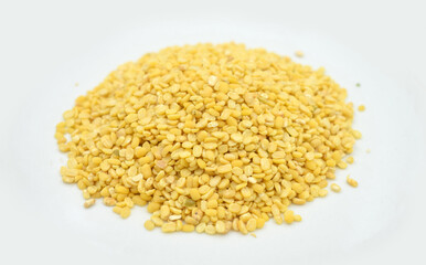 Yellow mung beans on white background