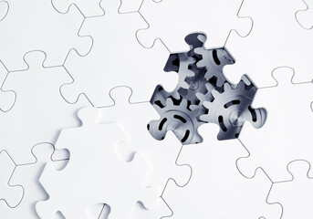 Behind the Jigsaw Puzzle. Metallic gears of an abstract mechanism are visible through empty piece of a jigsaw puzzle. 3D-rendering graphics.