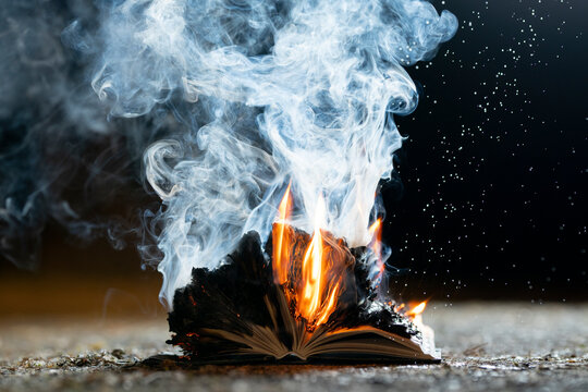 A burning book at night