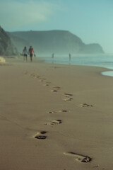 Couple in love walking on the beach on vacation