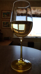 glass of white wine. Elegant wineglass closeup