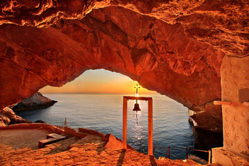 SYROS ISLAND, GREECE.
Sunset at the cave of the church of Agios Stefanos, close to Galissas village.