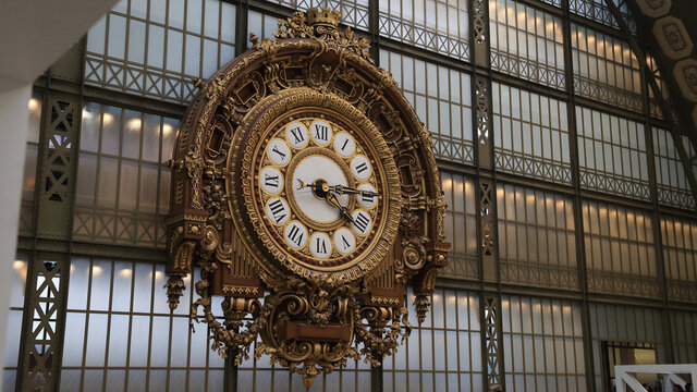 PARIS, FRANCE - OCTOBER 28, 2018: Extremely large old station golden clock in Orsay museum. 