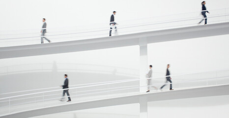 Business people walking along elevated walkway