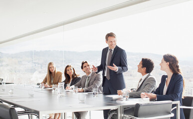 Fototapeta premium Businessman leading meeting in conference room