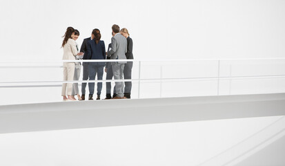 Business people meeting on elevated walkway