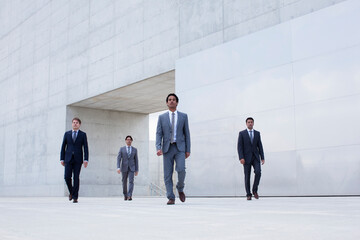Businessmen leaving modern cultural center