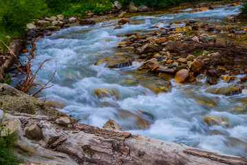 mountain river rushing over the stones in a canyon