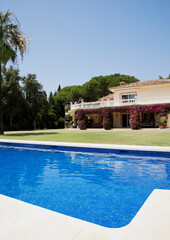 Luxury lap pool and Spanish villa