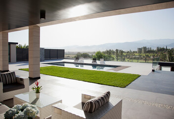 Luxury patio overlooking swimming pool and mountains