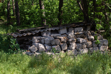 pieces of concrete lie in the forest in summer