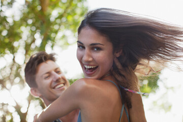 Close up of man spinning smiling girlfriend