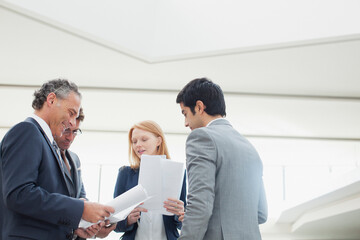 Business people discussing paperwork