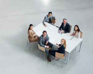 Portrait of smiling business people meeting at table