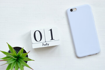 1st july first day month calendar concept on wooden blocks.