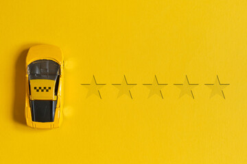 Taxi rating concept of 5 stars and cars with a sign on a yellow background with top view.