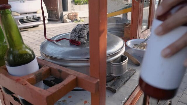 man selling bakso in the carts. indonesia street food. small business entrepreneur