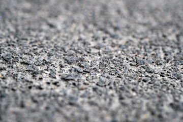 asphalt close-up with blurry edges.