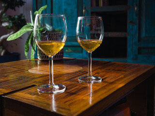 Two glass of white wine standing on the table