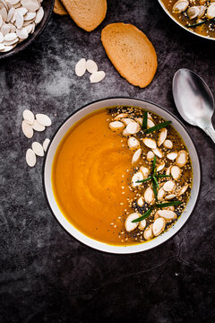 Overhead view of pumpkin soup with seeds