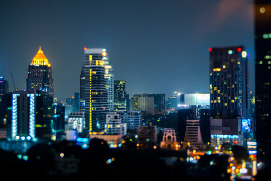 Thailand, Bangkok, Tilt shift of downtown skyscrapers at night