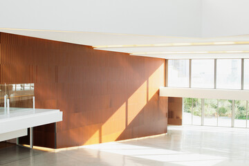 Sun shining through windows in empty modern lobby
