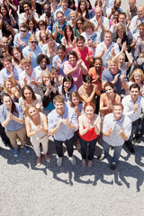 Portrait of smiling crowd clapping