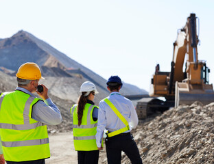 Business people talking in quarry
