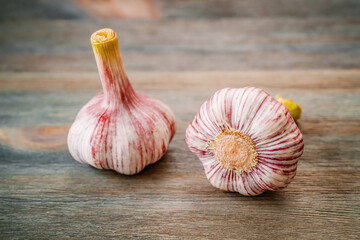 Garlic cloves on wooden background