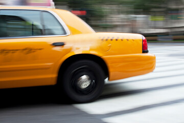 Fototapeta na wymiar Blurred view of taxi on city street