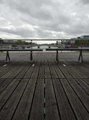 A symmetric view over the Seine river from the bridge Passerelle Simone de beauvior in, Paris, France