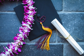Graduation with mortar, lei and diploma