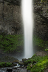 Waterfall in rocky rural landscape