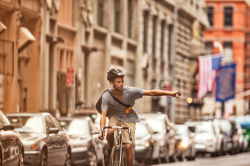 Man riding bicycle on city street