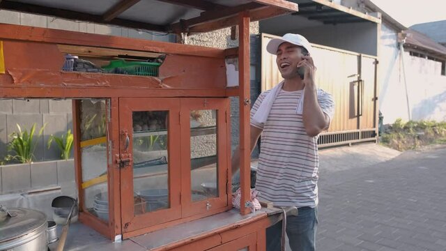 man selling bakso in the carts. indonesia street food. small business entrepreneur