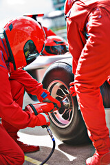 Racing team working at pit stop
