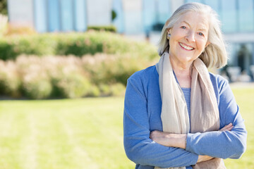 Fototapeta premium Smiling older woman standing outdoors
