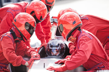 Racing team working at pit stop - obrazy, fototapety, plakaty