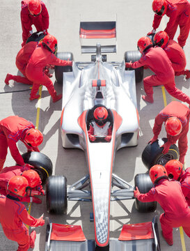 Racing Team Working At Pit Stop