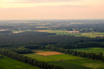 An aerial photo shows the rural character of parts of East-Flanders. Here, close to Moerbeke, the plain consists of delineated forests and fields.