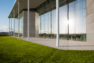Fototapeta na wymiar Modern building and green lawn